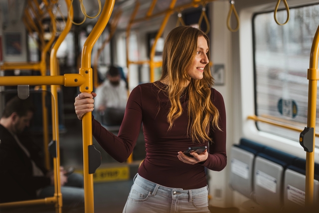Woman standing in a tram