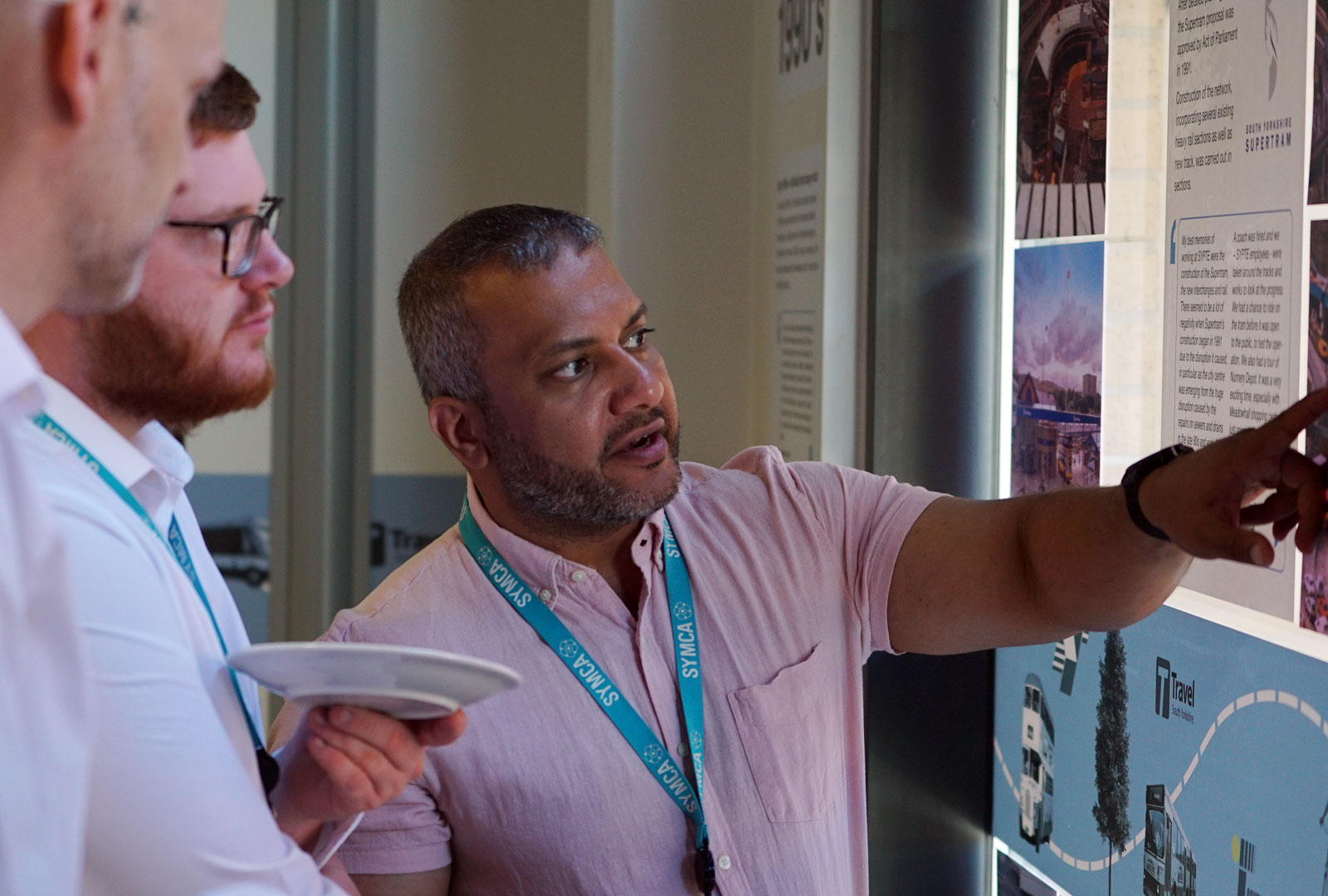 Man pointing at presentation.