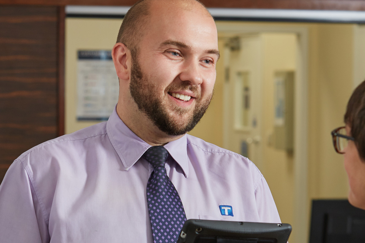 Smiling man in shirt and tie