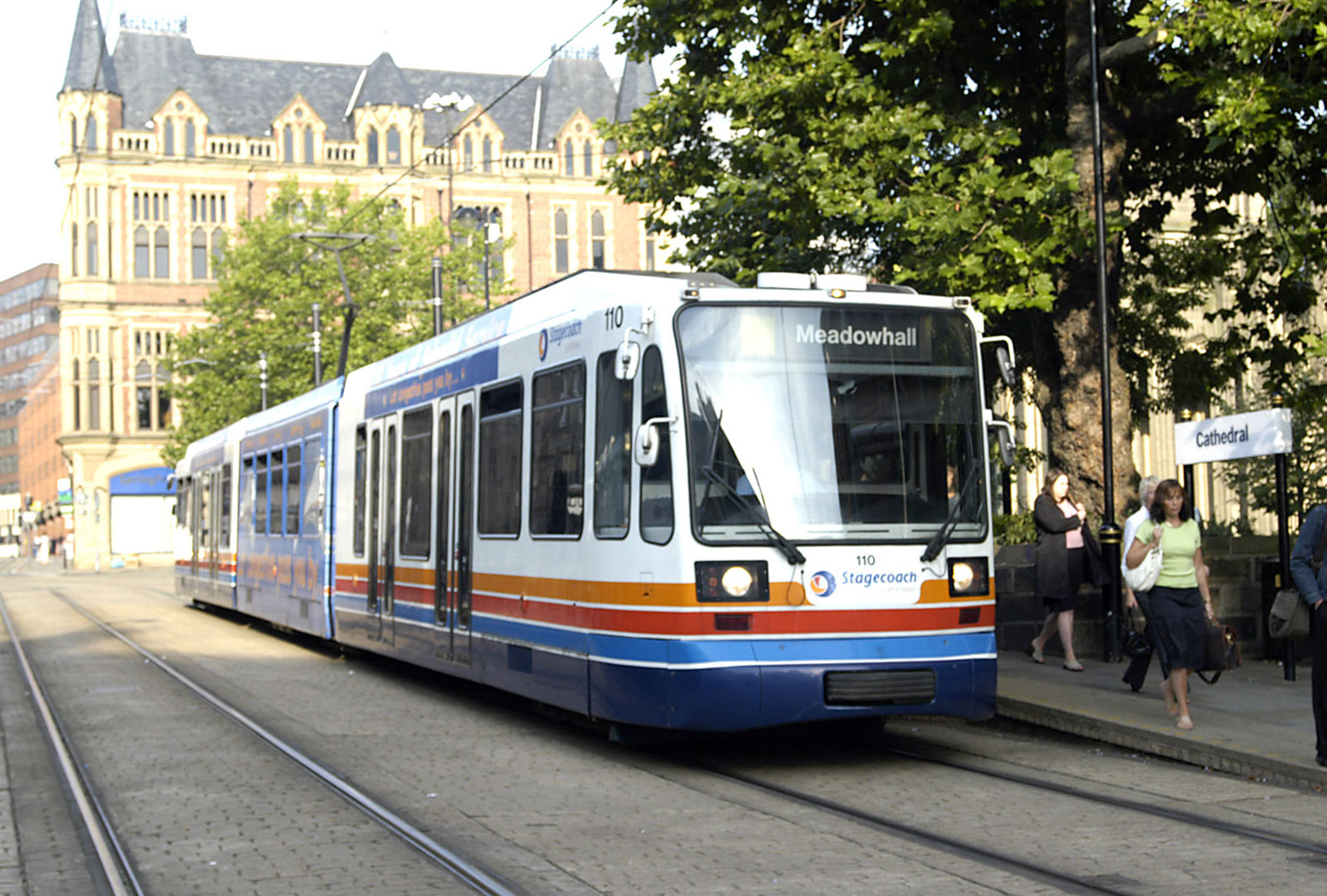 Front on image of old school tram near Sheffield Cathederal